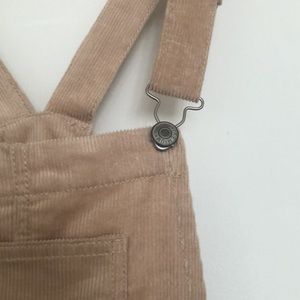 Corduroy overalls with raw hem